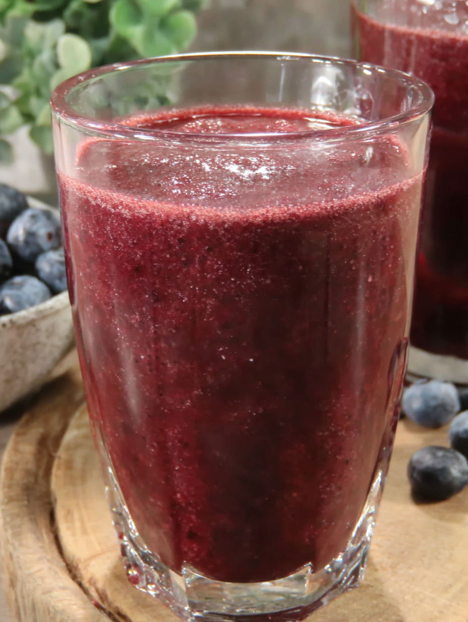A glass of cranberry blueberry juice.