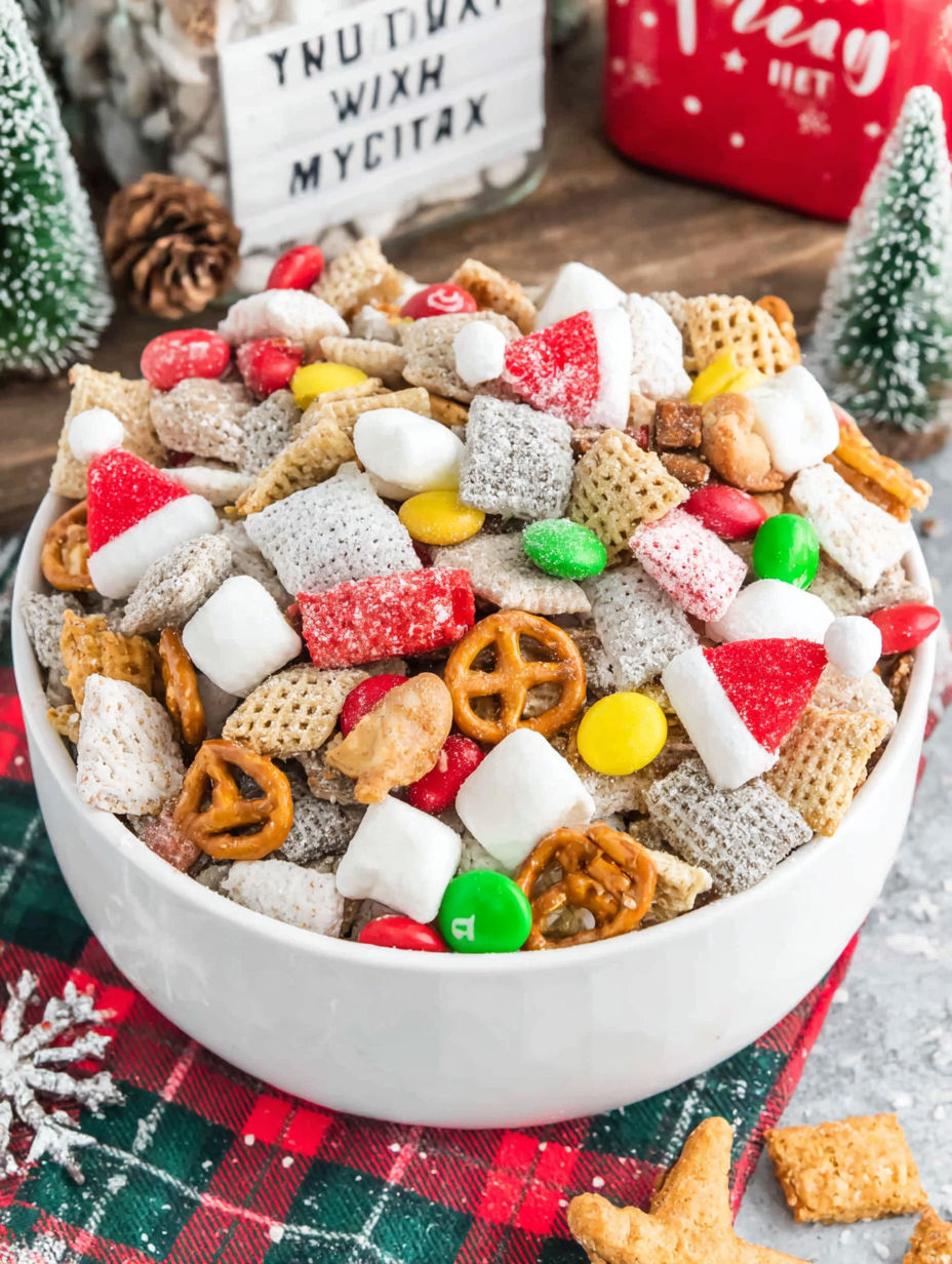 A bowl full of Christmas snacks.