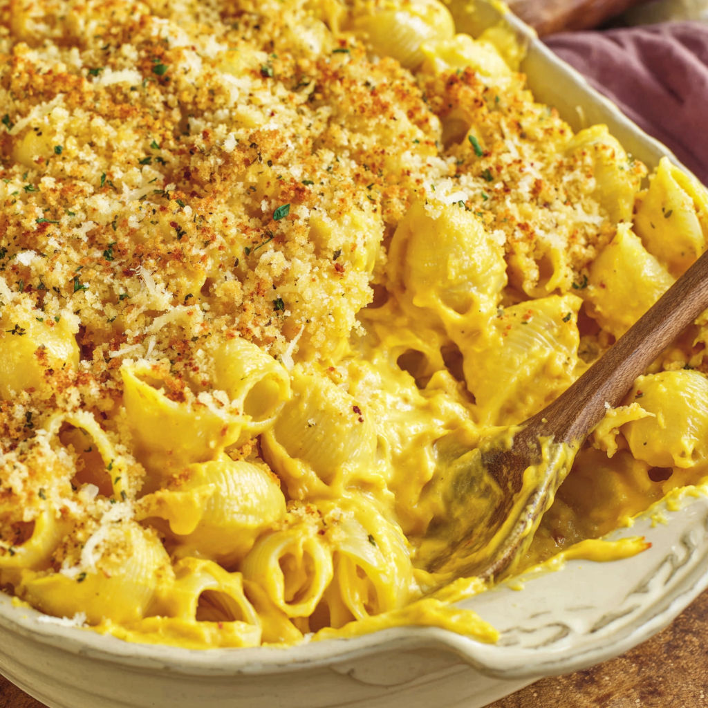 A dish of mac and cheese with butternut squash.