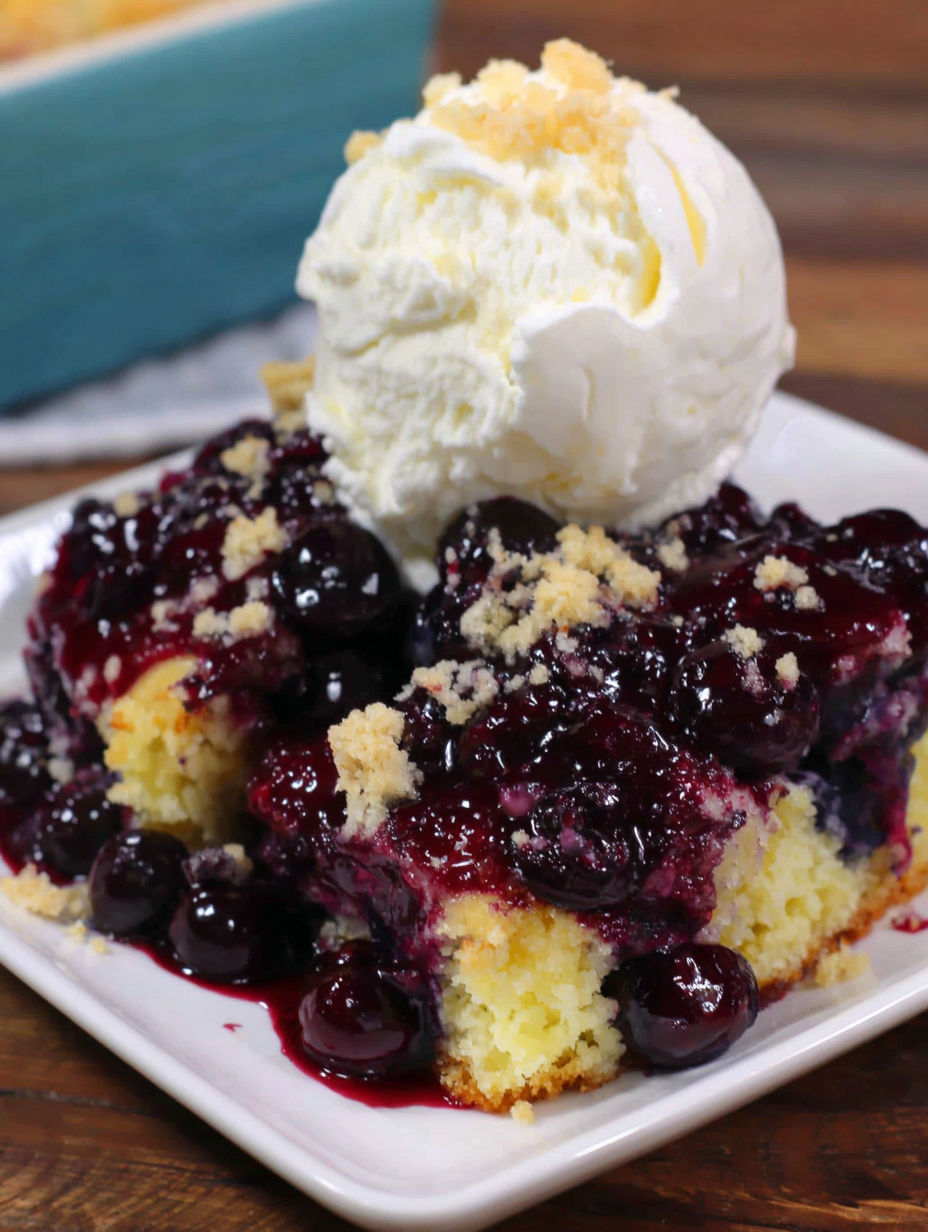 A slice of lemon blueberry dump cake.