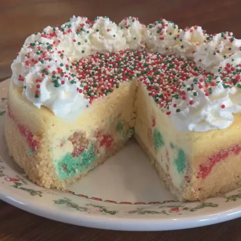 A slice of a sugar cookie cheesecake.