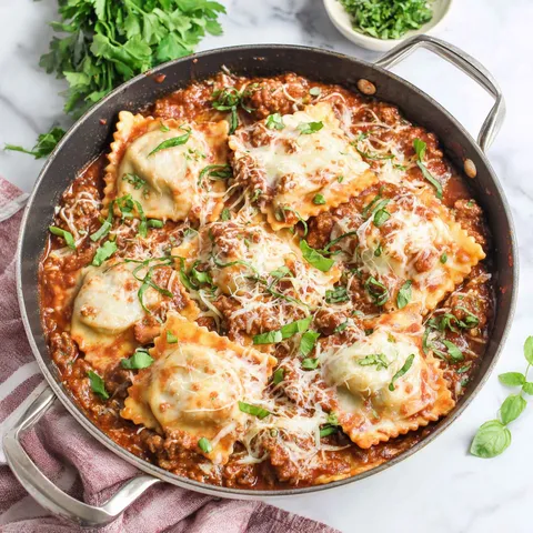 A skillet filled with pasta and meat.