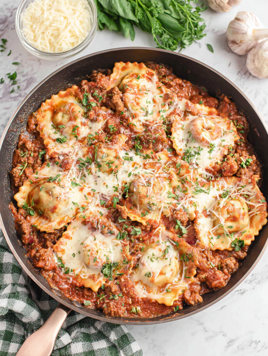 A skillet filled with pasta and meat.