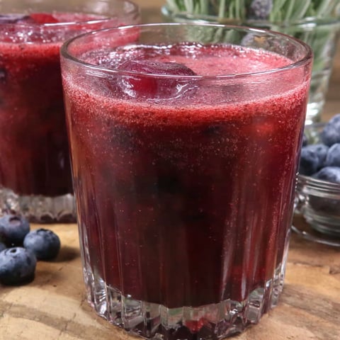 A glass of cranberry blueberry juice.