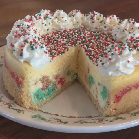 A slice of a sugar cookie cheesecake.