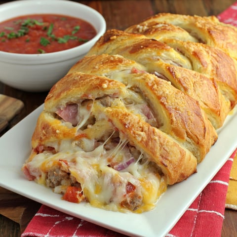 A Meat Lover's Crescent Braid on a plate.